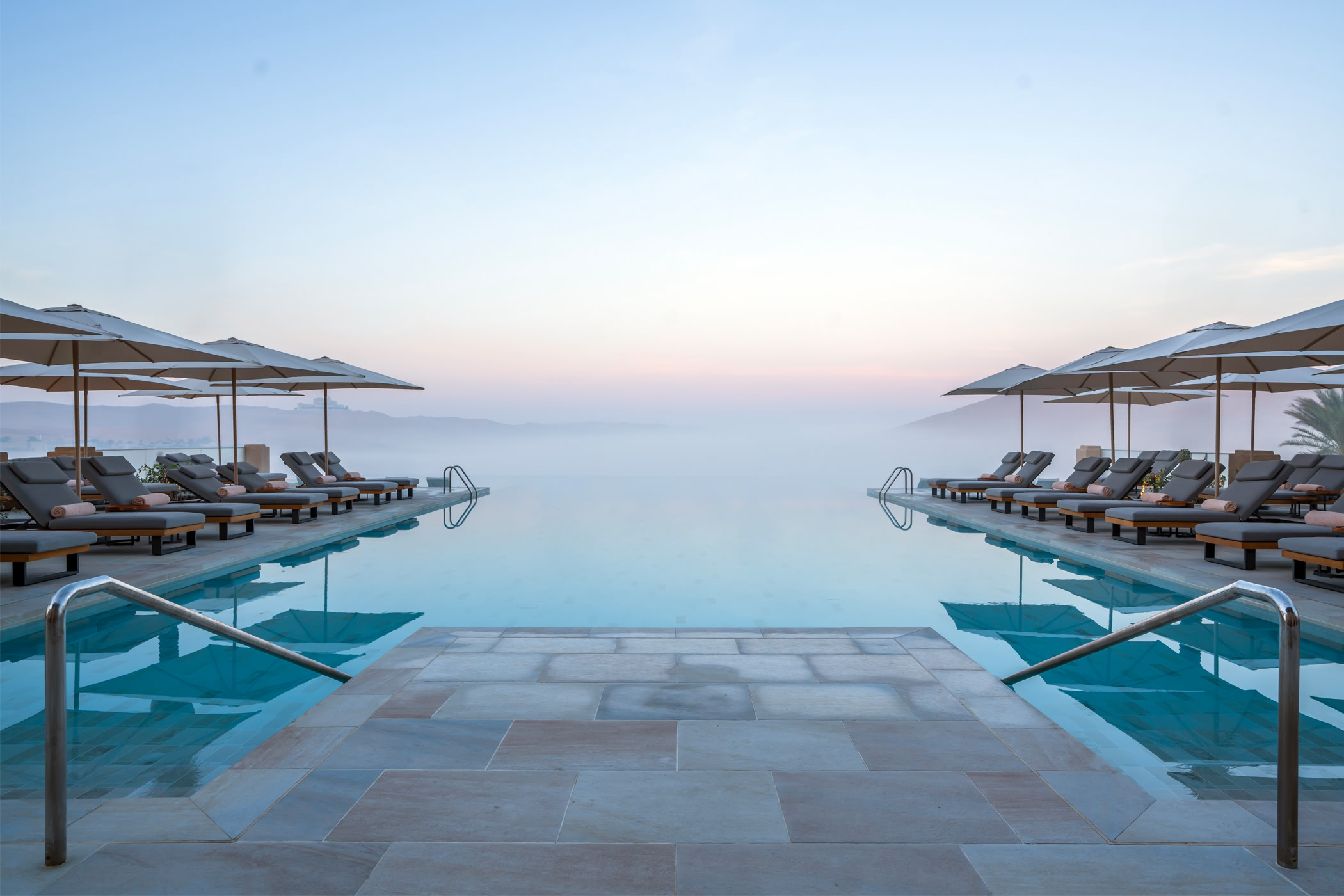 Qasr Al Sarab Desert Resort by Anantara Pool Shrouded In Morning Mist